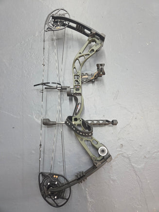 Green compound bow with accessories